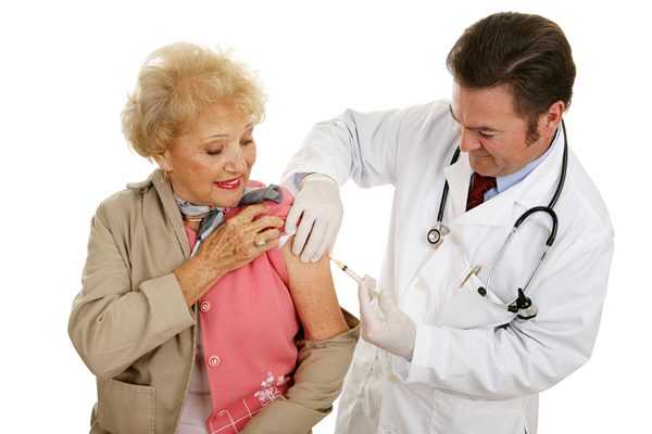 male doctor takes blood sample from senior woman male doctor takes blood sample from senior woman