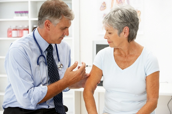 male doctor takes sample from female patient