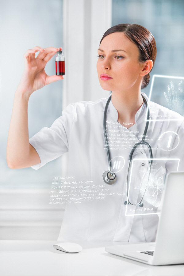 portrait of pretty female laboratory assistant analyzing a blood sample portrait of pretty female laboratory assistant analyzing a blood sample