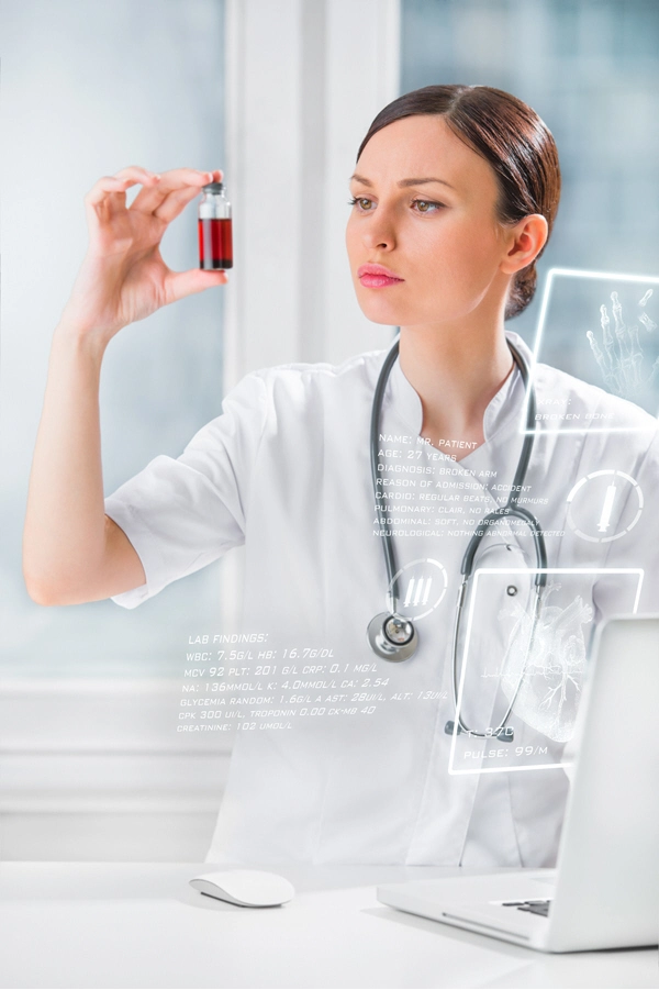 portrait of pretty female laboratory assistant analyzing a blood sample