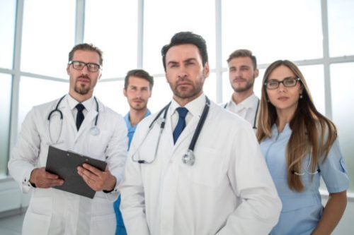 group of doctors staring at the camera e1556710184433