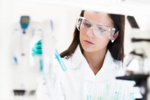 chemical laboratory scene attractive young phd student HGH scientist observing the blue indicator  300x200