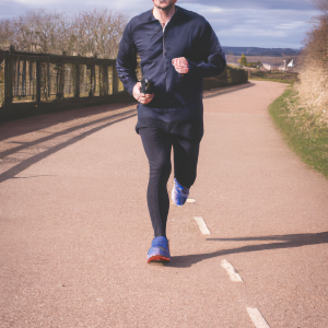 a professional appealing image of a caucasian man or woman jogging on a sunny day 518 300x300