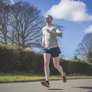 a professional appealing image of a caucasian man or woman jogging on a sunny day 606 300x300